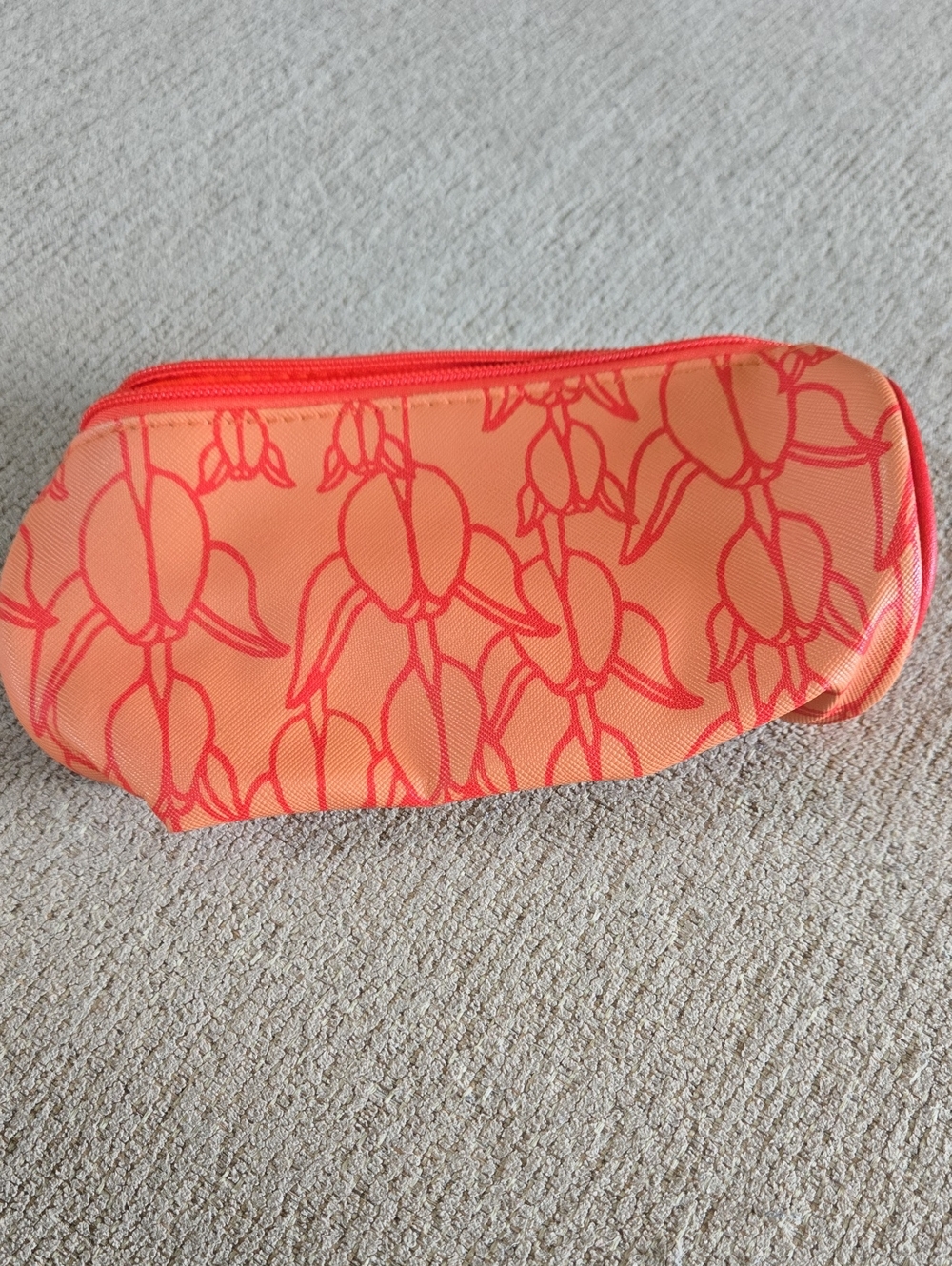 Manaola Orange Floral Print Cosmetic Bag with Coral Accents